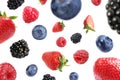 Many different berries flying on white background