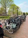 Many different bicycles parked on city street Royalty Free Stock Photo