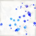 Many different blue paint blobs on paper