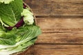 Many different cabbage leaves on wooden table, top view. Space for text Royalty Free Stock Photo