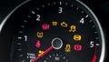 Many different car dashboard lights with warning lamps illuminated. Light symbol that pops up on dashboard when