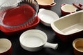 Many different casseroles on black table, closeup Royalty Free Stock Photo