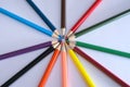 Many different colored pencils arranged in circle, creative design, top view, flat lay