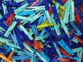 Many different colored plastic clothes pegs close up. Lots of clothespins Royalty Free Stock Photo