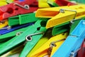 Many different colored plastic clothes pegs close up Royalty Free Stock Photo