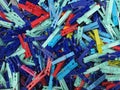 Many different colored plastic clothes pegs close up. Lots of clothespins Royalty Free Stock Photo