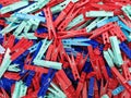 Many different colored plastic clothes pegs close up. Lots of clothespins Royalty Free Stock Photo