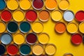 Many different colored tin cans with paint. House rennovation, design ideas, bright conceptual photo Royalty Free Stock Photo