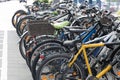 many different colorful bicycles parked public place