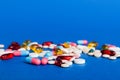 Many different colorful medication and pills perspective view. Set of many pills on colored background Royalty Free Stock Photo