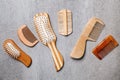 Many different combs and hairbrushes on grey background, flat lay Royalty Free Stock Photo