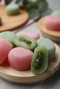 Many different delicious mochi on wooden board, closeup. Traditional Japanese dessert