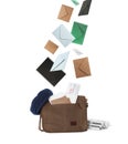 Many different envelopes falling into brown postman`s bag on white background Royalty Free Stock Photo
