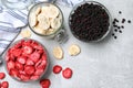 Many different freeze dried fruits on light grey table, flat lay Royalty Free Stock Photo