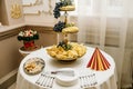 Wedding decorations. Reception. Buffet. Fruits and cheese on pla