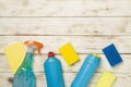 Many different house cleaning products on wooden background, top view Royalty Free Stock Photo