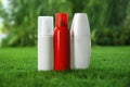 Many different insect repellents on green grass Royalty Free Stock Photo