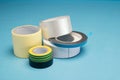 Many different kind of scotch tapes on a blue background