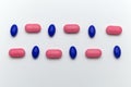 Many different medical pills between blue and pink color Royalty Free Stock Photo