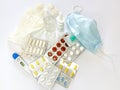 Many different medicines: tablets, pills in blister pack, medications drugs, medical gloves, mask, syringe, thermometer, spray, Royalty Free Stock Photo