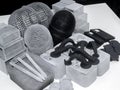 Many models printed on 3D printer. Gray and black objects printed 3D printer.