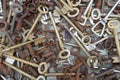 Many different old, rusty keys to sell at the flea market. Close up, background and texture