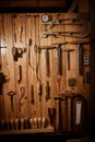 Many different old tools hanging on wall Royalty Free Stock Photo