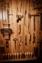 Many different old tools hanging on wall Royalty Free Stock Photo