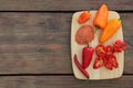 Many different peppers and spoon with spice on wooden table, top view. Space for text Royalty Free Stock Photo