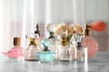 Many different perfume bottles on table