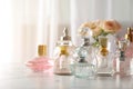 Many different perfume bottles on dressing table Royalty Free Stock Photo