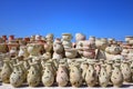 Many different pottery vases are for sale on a market in the Mediterranean region against a blue sky Royalty Free Stock Photo