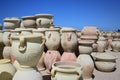 Many different pottery vases are for sale on a market in the Mediterranean region against a blue sky Royalty Free Stock Photo