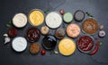 Many different sauces on black table, flat lay Royalty Free Stock Photo