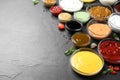 Many different sauces on black table, space for text Royalty Free Stock Photo