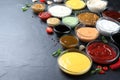 Many different sauces on black table, space for text Royalty Free Stock Photo