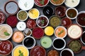 Many different sauces and herbs on black table, flat lay Royalty Free Stock Photo