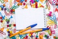 Many different school supplies and empty notepad white sheet of paper. Back to school concept Royalty Free Stock Photo