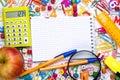 Many different school supplies and empty notepad white sheet of paper. Back to school concept Royalty Free Stock Photo