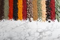 Many different spices on marble background, top view. Space for text Royalty Free Stock Photo