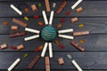 Many different Sweet types of chocolate lie in geometric order on black wooden table. Royalty Free Stock Photo