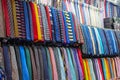 Many different ties of multi colors on display at the exhibition showcase. Large assortment of items for customers to choose from