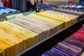 Many different ties of multi colors yellow gradient assortment display at the exhibition showcase. Large assortment of items for