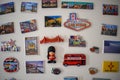 Many different travel magnet souvenir on the white fridge - Image