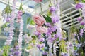 Many different type of sweet artificial flower hanging from ceiling. Beautiful Upside down flowers