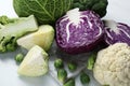Many different types of cabbage on white table Royalty Free Stock Photo