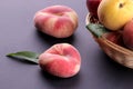 Many different varieties of peaches in a wicker basket on a black background Royalty Free Stock Photo