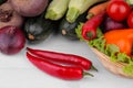 Different vegetables include beets, cabbage, zucchini, carrots, tomatoes, peppers, onions, garlic, and cucumbers and lettuce on a Royalty Free Stock Photo