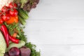 Different vegetables include beets, cabbage, zucchini, carrots, tomatoes, peppers, onions, garlic, and cucumbers and lettuce on a Royalty Free Stock Photo