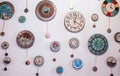 Many different wall clock on the wall